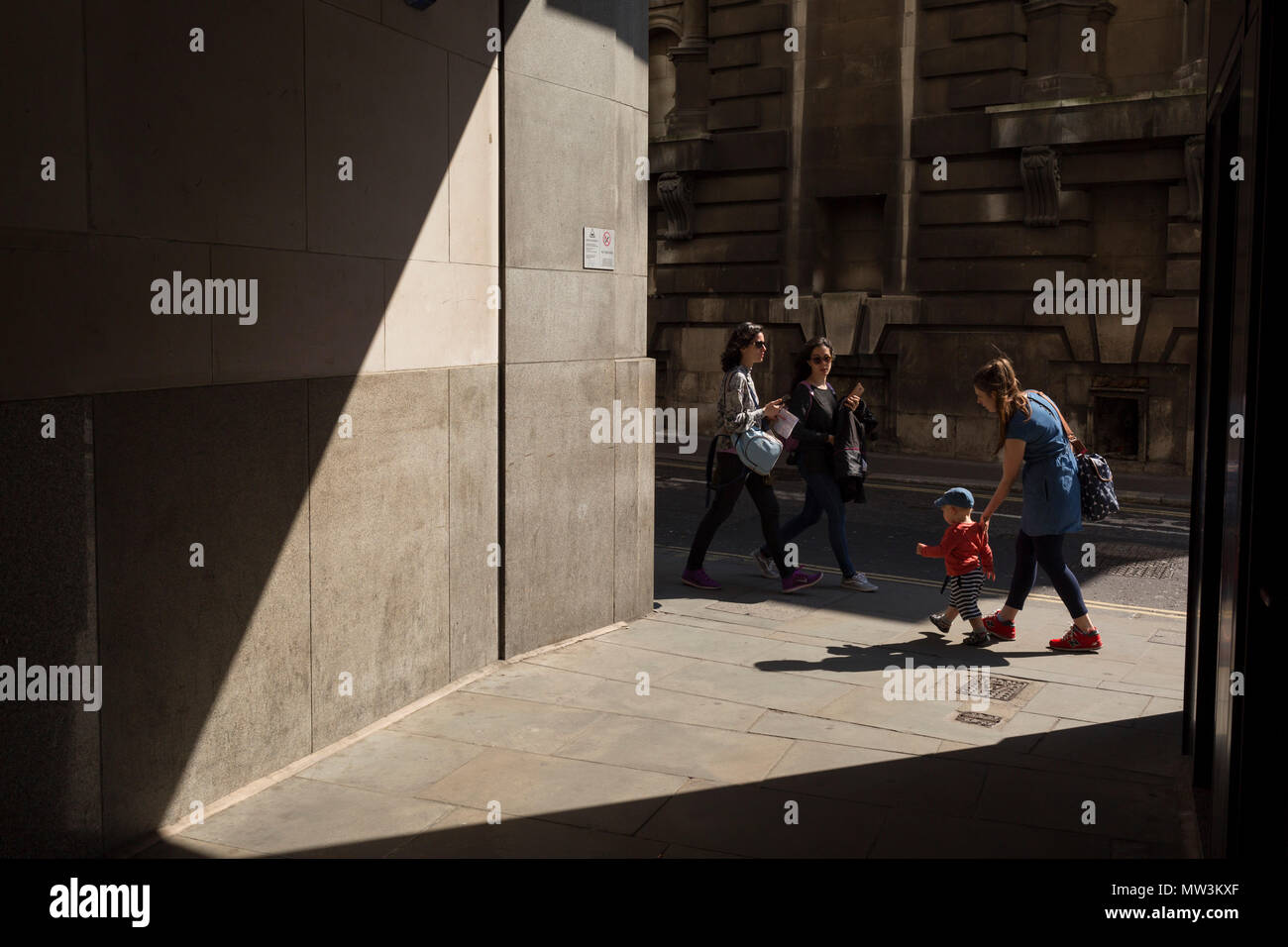 A mother and small child in Lombard Street in the City of London, the capital's financial district aka the Square Mile, on 15th May 2018, in London, UK. Stock Photo
