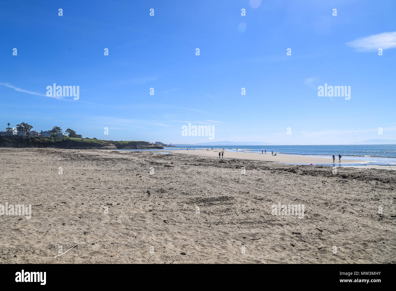 People walking on a beach on the pacific ocean coast near Malibu california Stock Photo