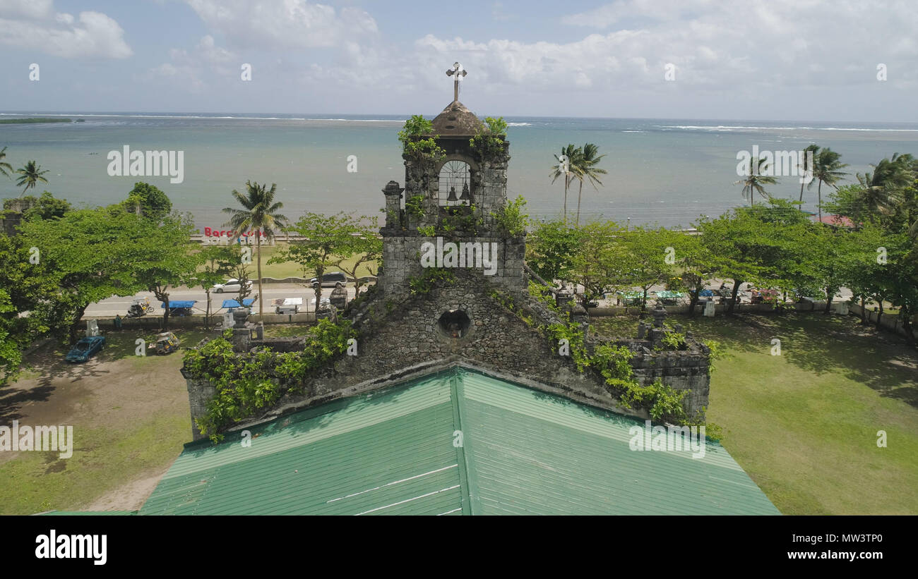 Old, ancient St Joseph church in the city of Barcelona, Sorsogon, Philippines. Church in the Spanish style on the coast near sea. Stock Photo