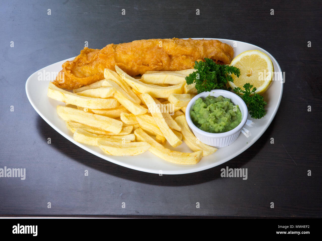 Fish and chips, a traditional popular British dish served with Ketchup