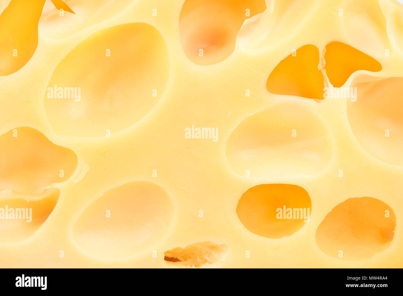 Background of Swiss cheese with holes closeup Stock Photo Alamy