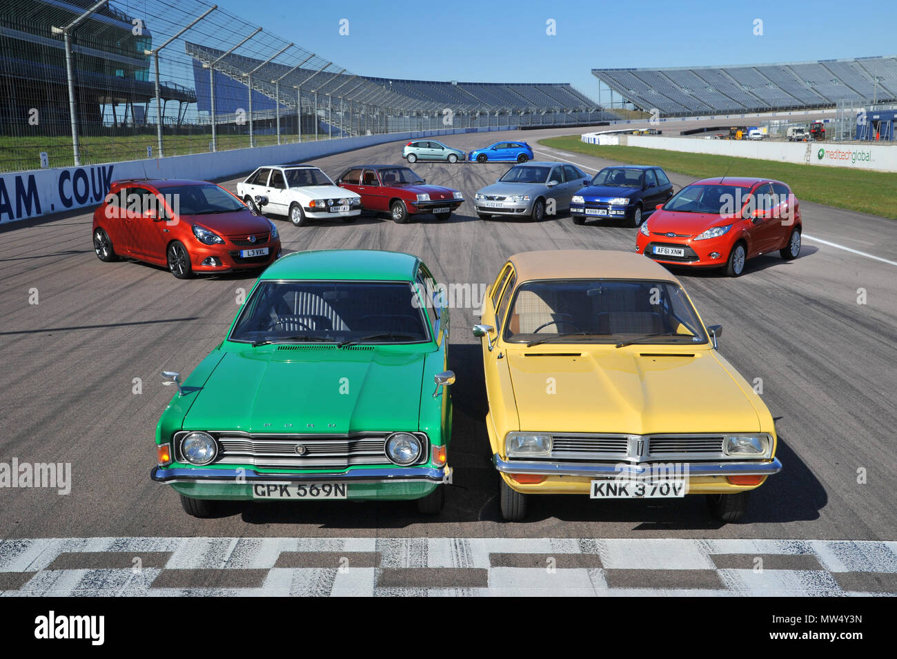 40 years of best sellers - Ford and Vauxhall rival cars from the 1970s to 2010s Stock Photo