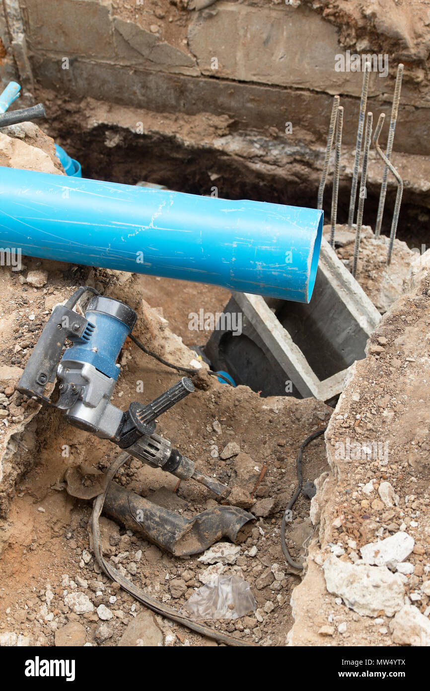 Repair the broken pipe in underground Stock Photo Alamy
