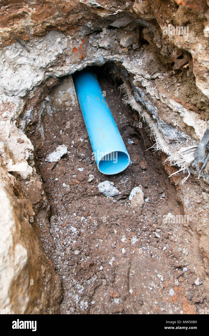 Repair the broken pipe in underground Stock Photo Alamy