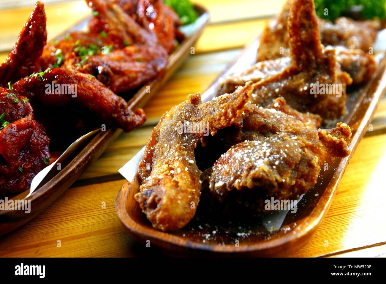 Photo of freshly cooked spicy and regular Buffalo wings Stock Photo