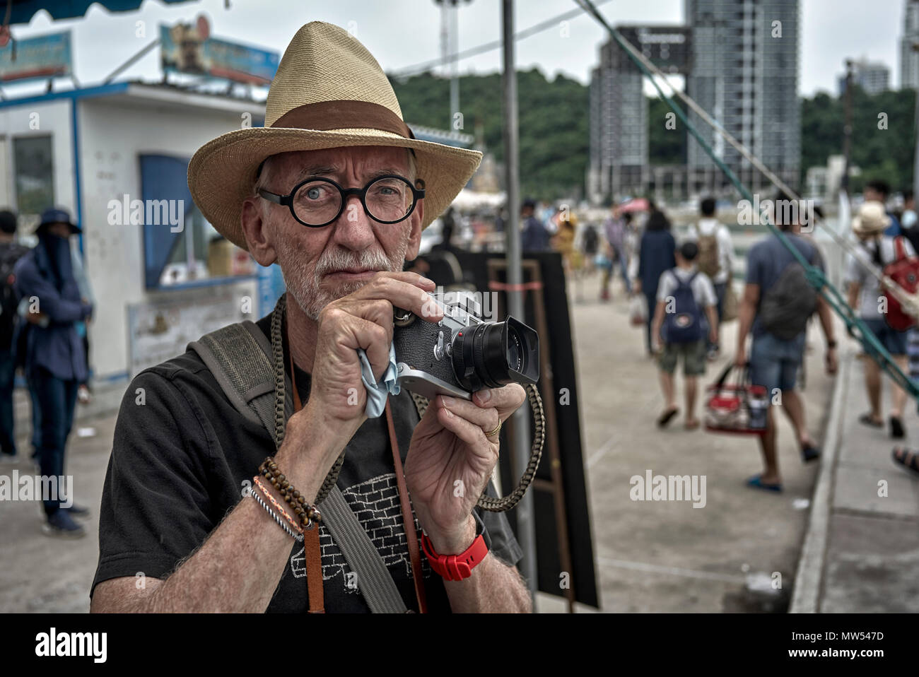 Man taking photograph with a vintage Leica M3 film camera. Stock Photo