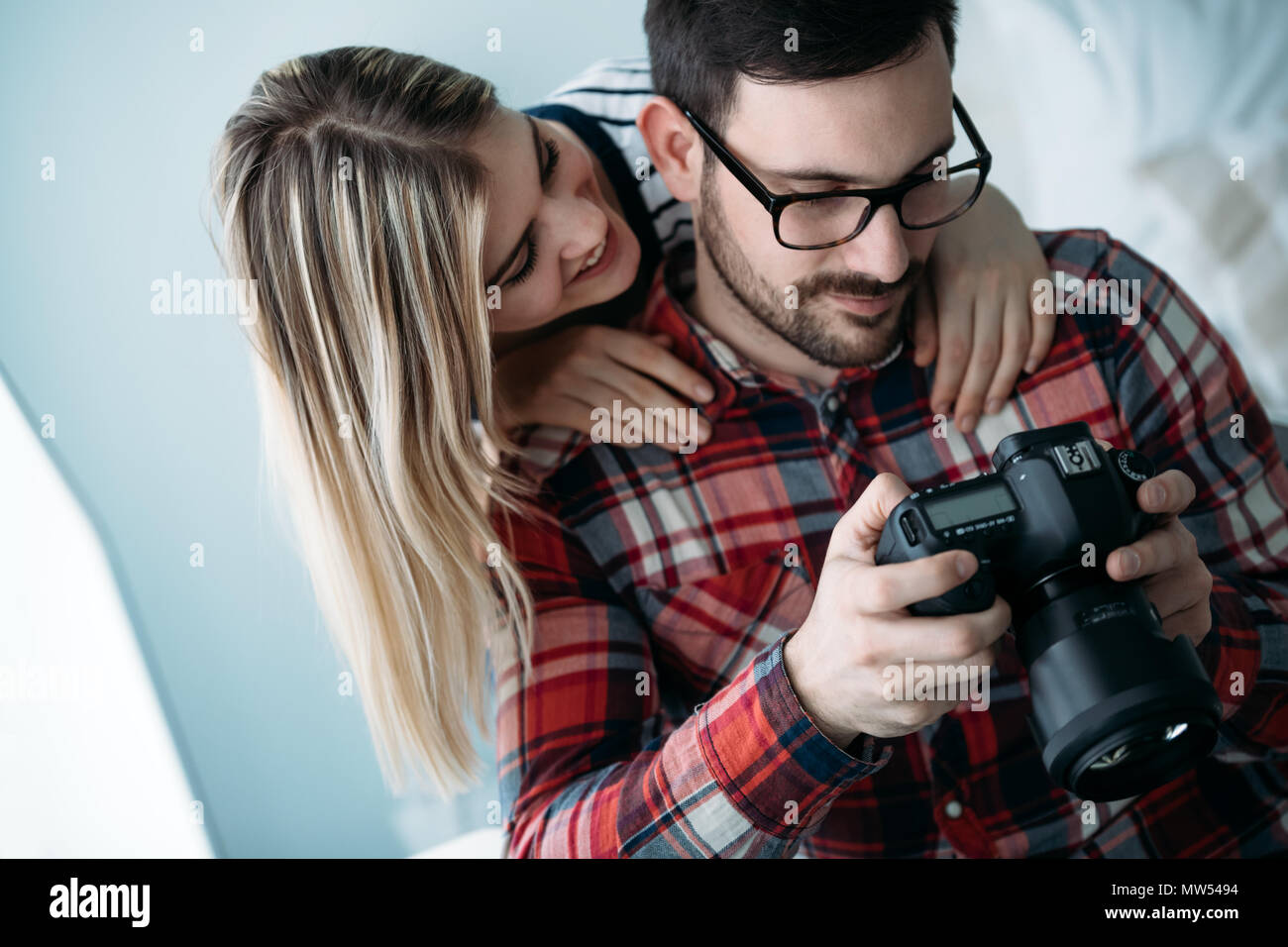 Young attractive designers working on project together Stock Photo