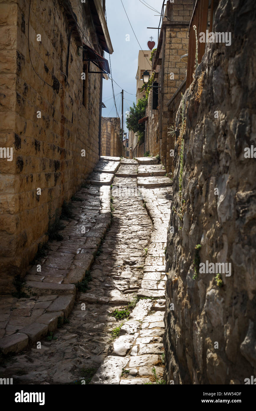 Ancient streets in traditional town Deir el Qamar in vertical position, Lebanon Stock Photo