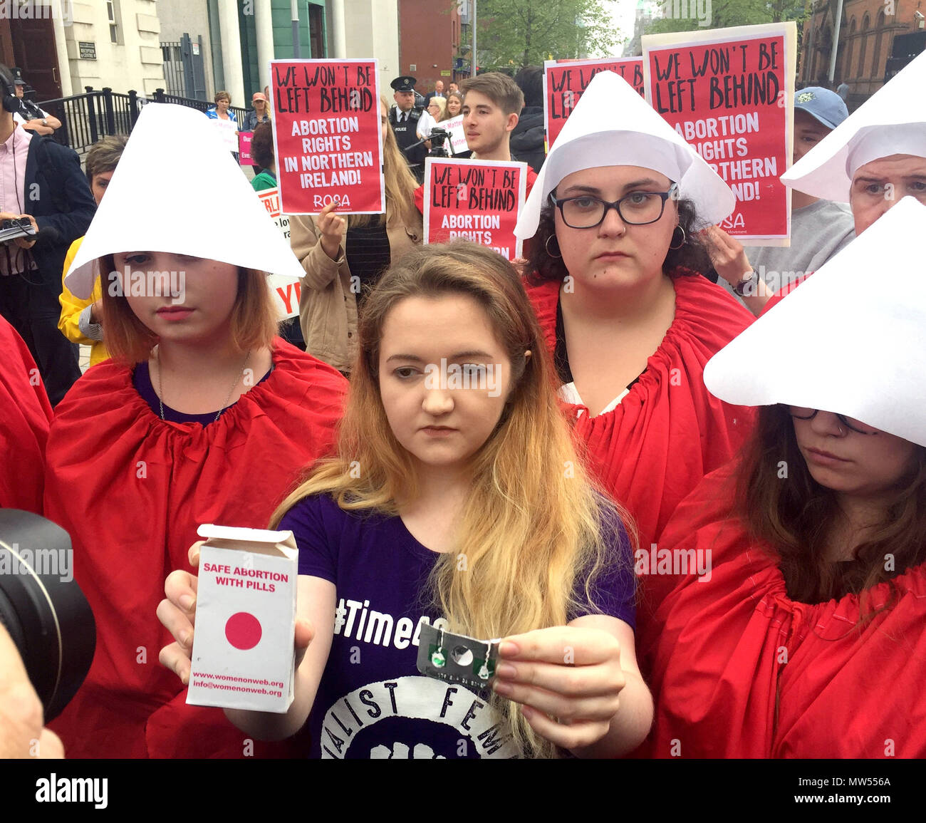 Eleanor Crossey Malone, from the socialist feminist group Rosa, after she took an abortion pill outside Belfast's Crown and High Courts, where counter-demonstrations were held by both sides of the Northen Irish abortion argument. Northern Ireland is the only part of the UK where the procedure is not legal. Stock Photo