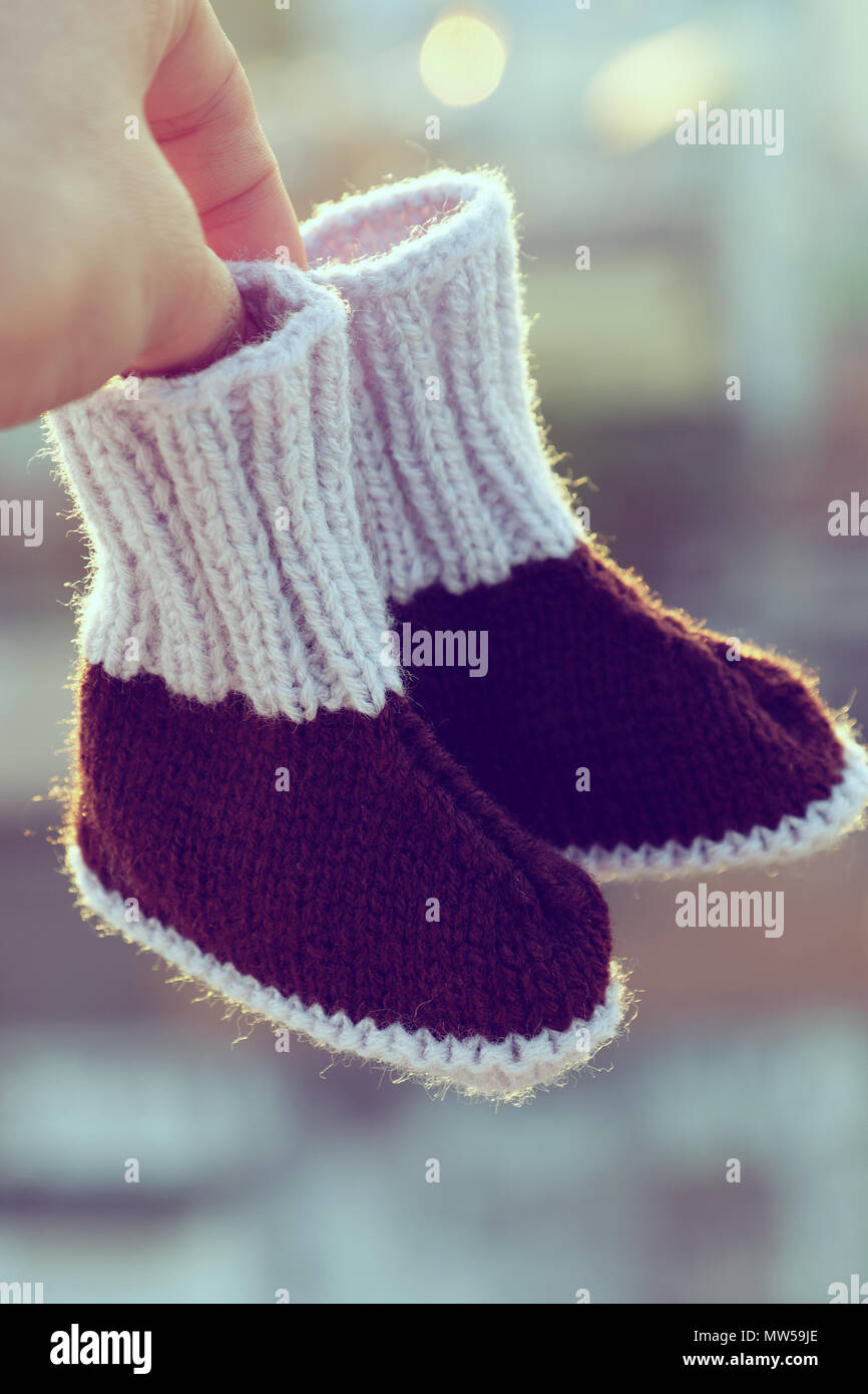 Knit baby booties for newborn from yarn close up of cute handmade