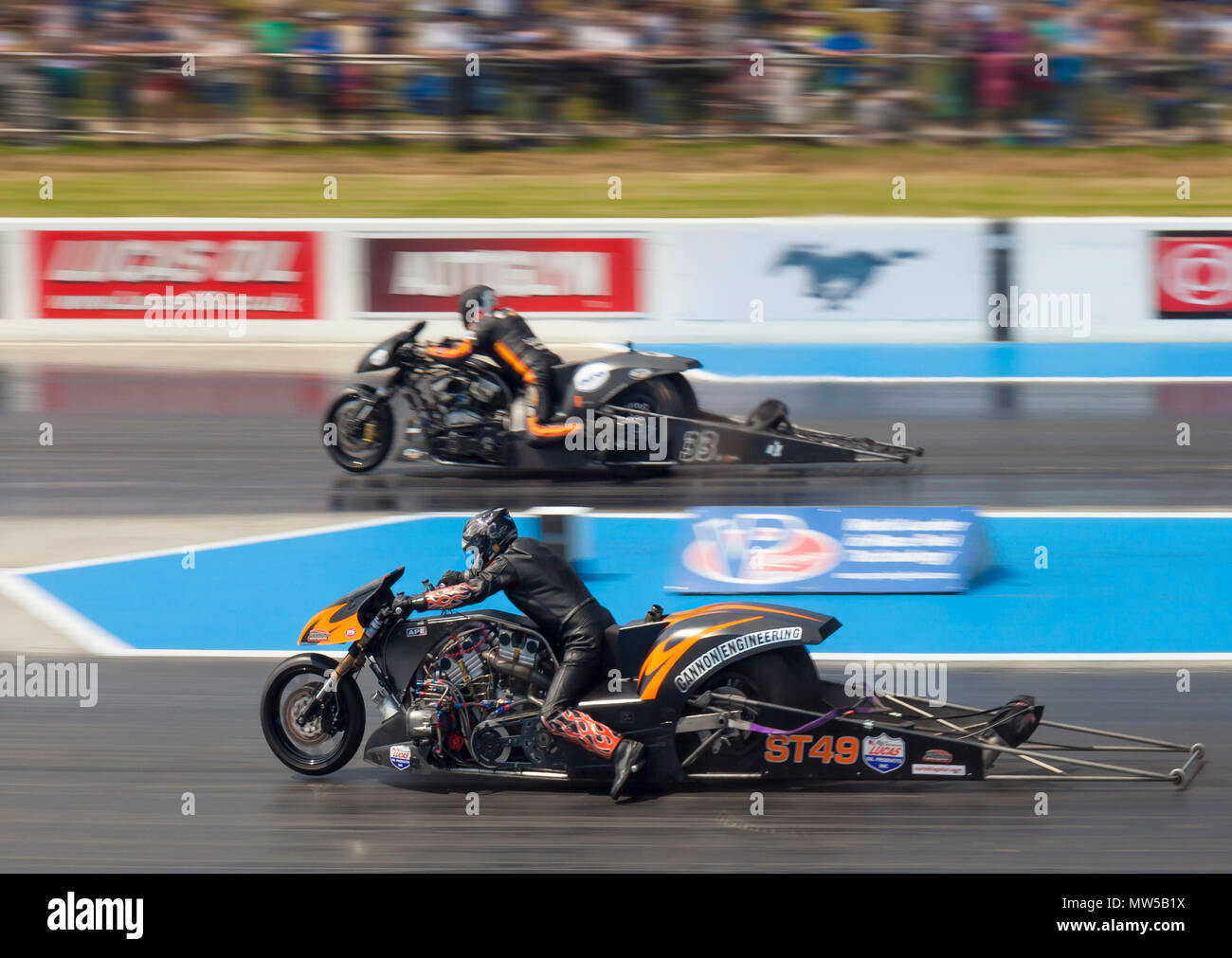 Supertwin bike drag racing at Santa Pod. Neil Midgley nearside V Gert Jan Lasear far side. Stock Photo