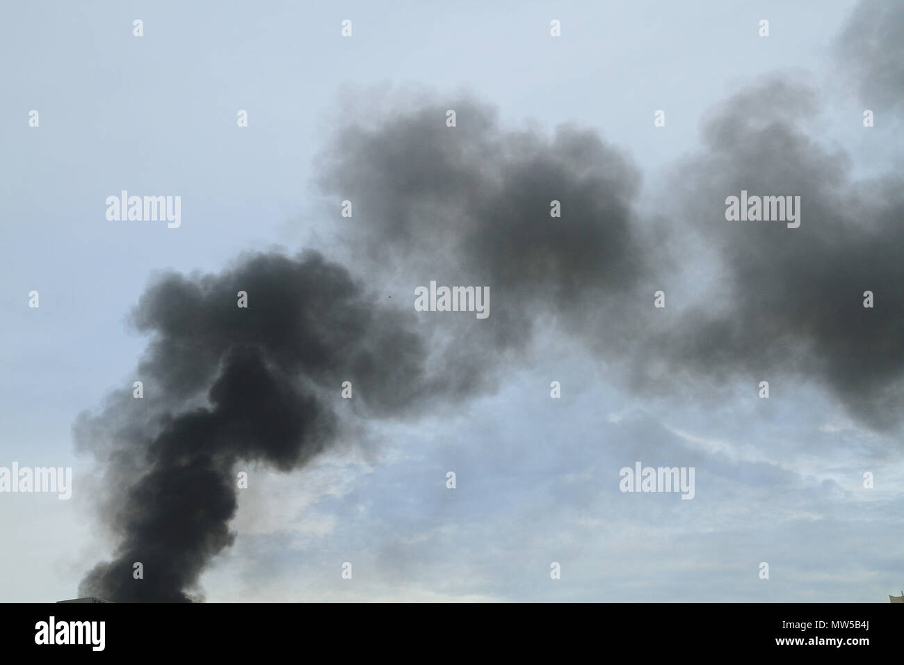 Black smoke from fire burning on the sky Stock Photo Alamy