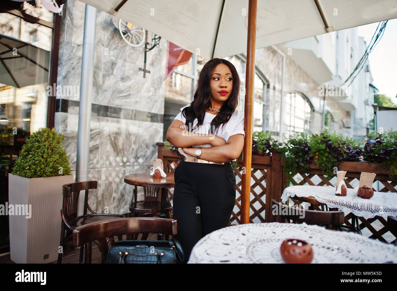 Stylish african american business woman on streets of city Stock Photo ...
