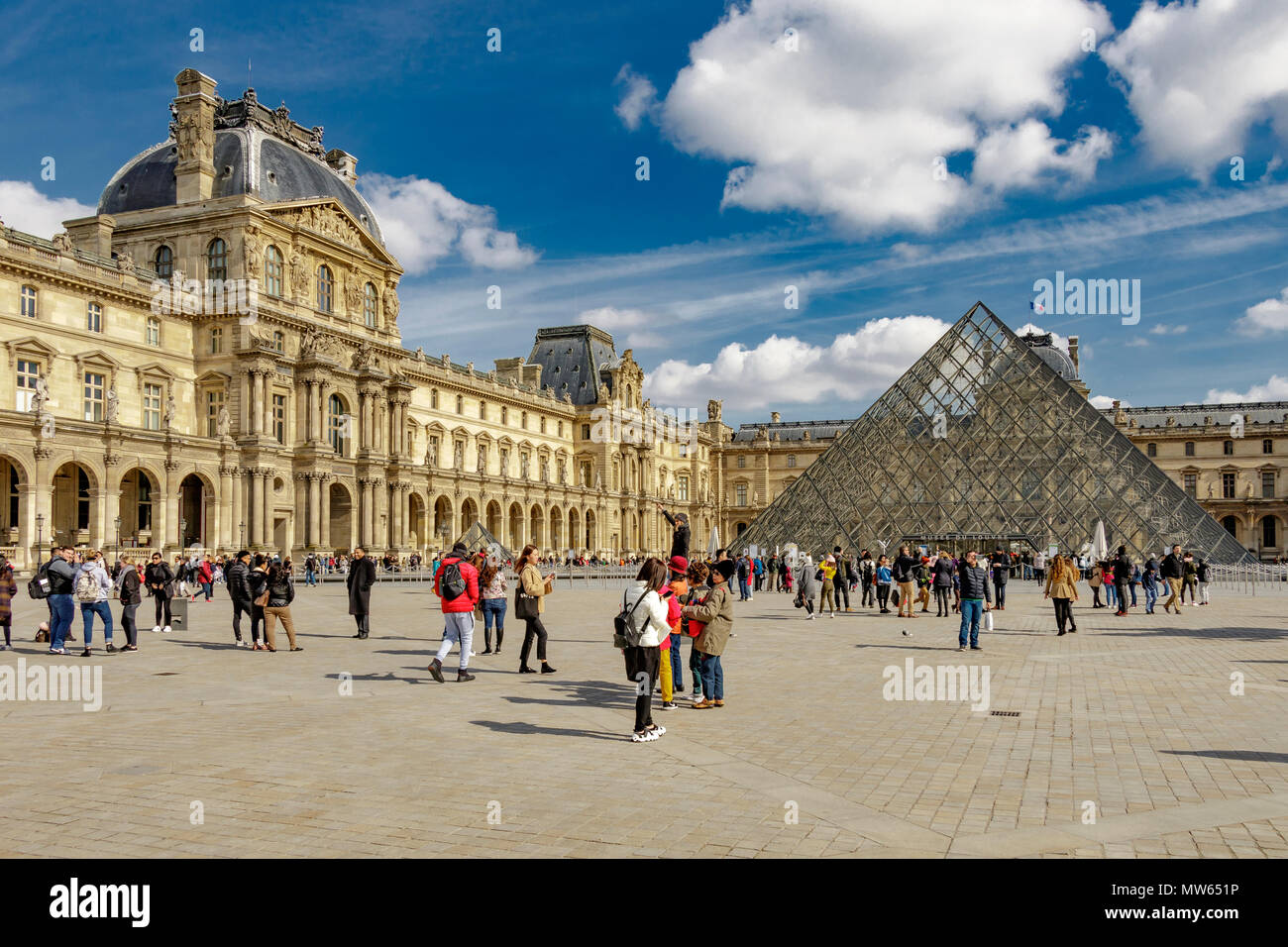 People outside The Louvre Pyramid , the main entrance to the The Louvre museum in Paris,France Stock Photo