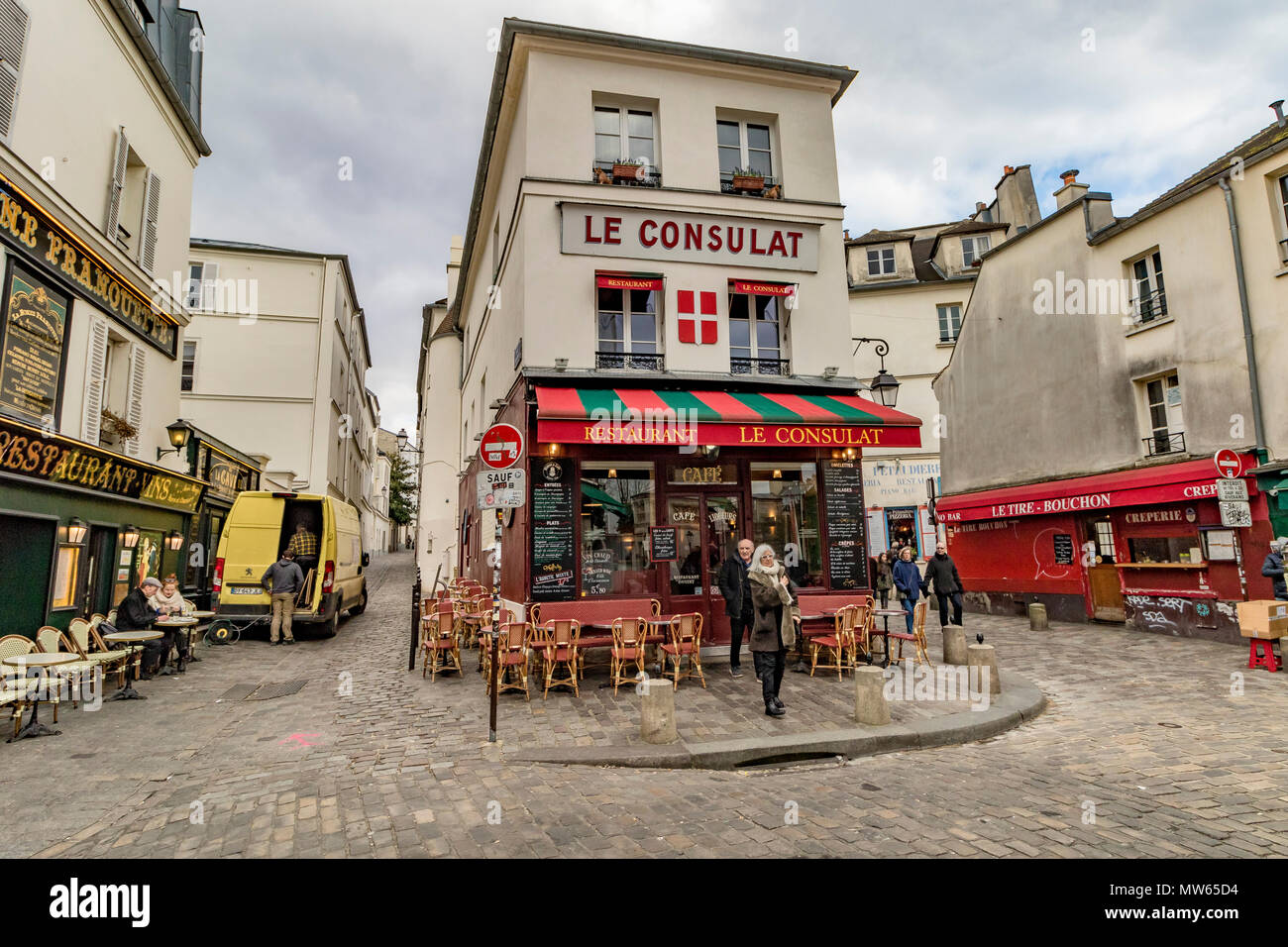 Wintertime in Paris ,tourists and visitors outside Le Consulat ,a popular restaurant and Café in Montmartre ,Paris ,France Stock Photo