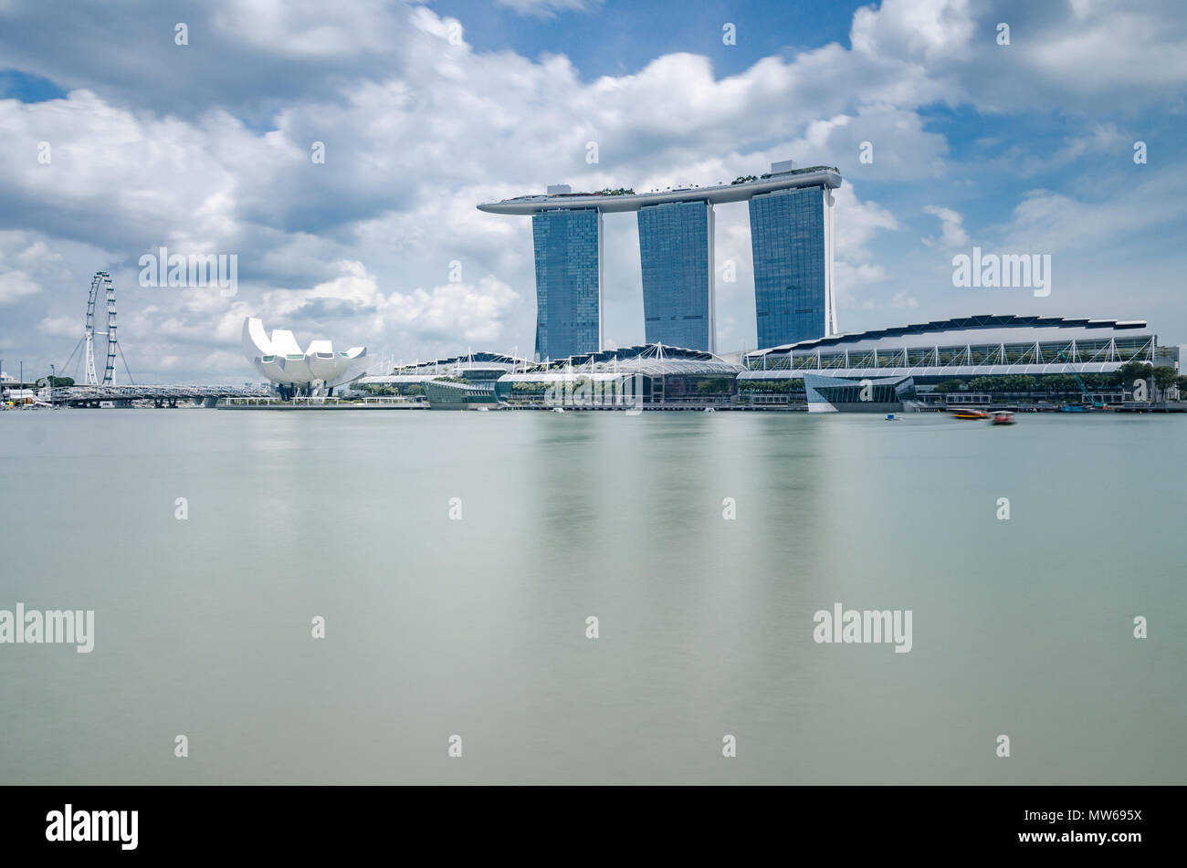 A beautiful day at Marina Bay with Marina Bay Sands Hotel at the background, one of the most spectacular Hotel in Singapore. Stock Photo