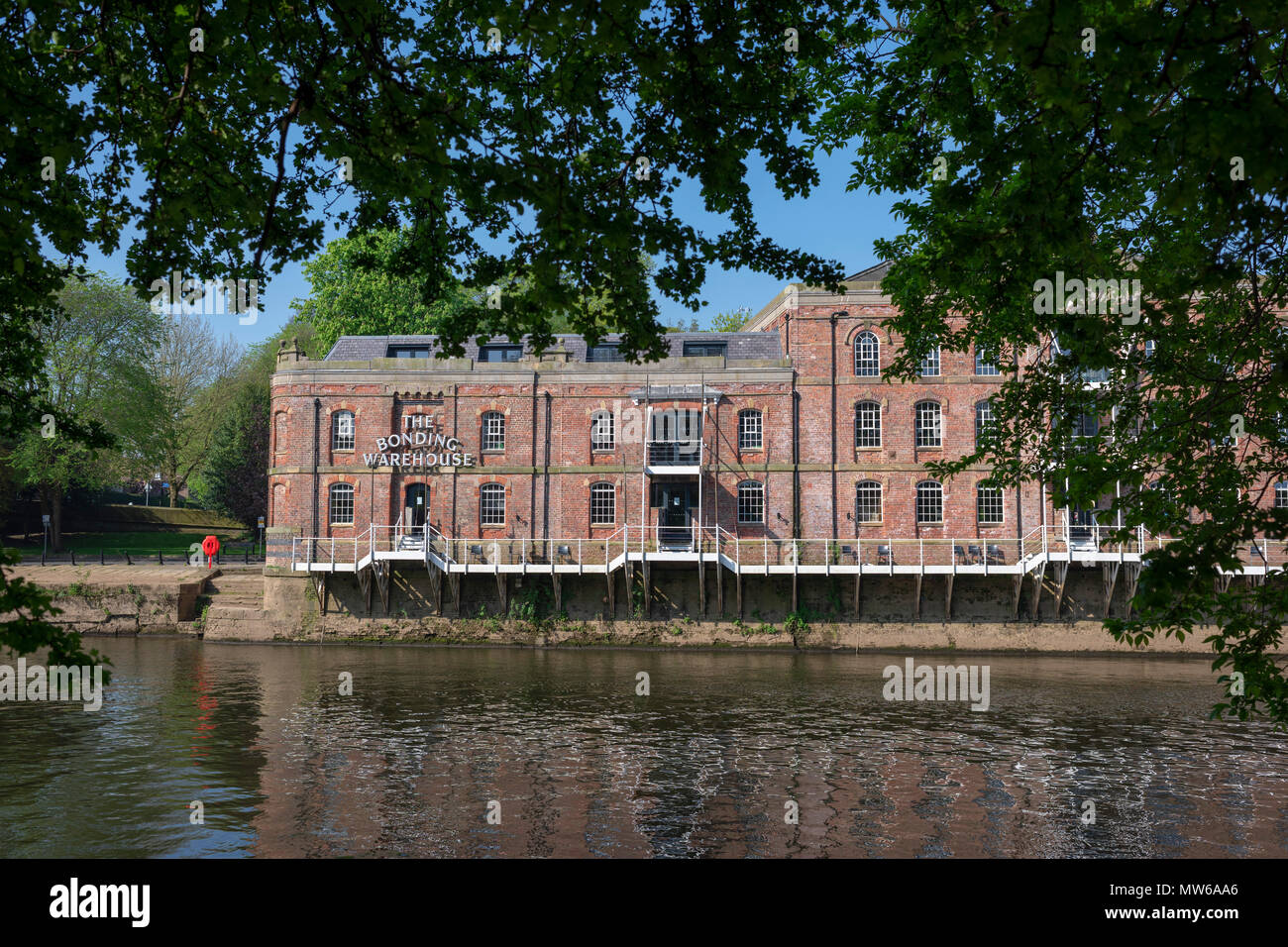 The Victorian Bonded Warehouse, transformed into luxury accommodation, fronting the River Ouse, York, UK Stock Photo