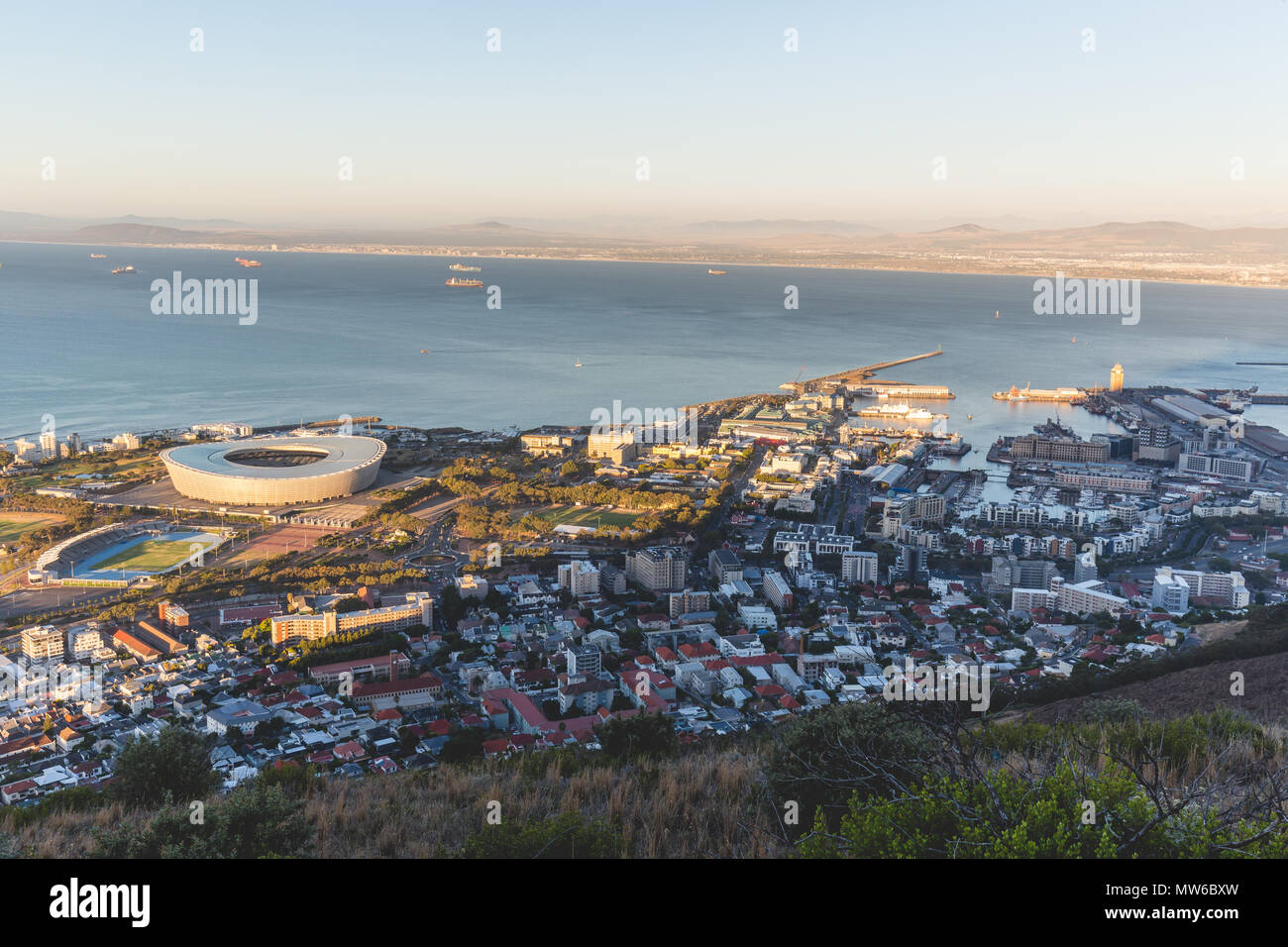 Late afternoon view of Green Point Stadium and Cape Town harbour Stock Photo