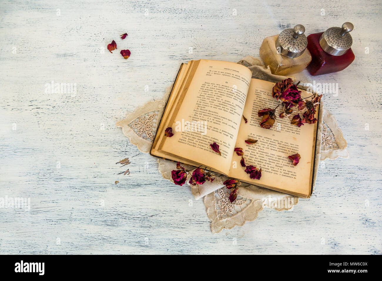 Old book and dry roses Stock Photo Alamy