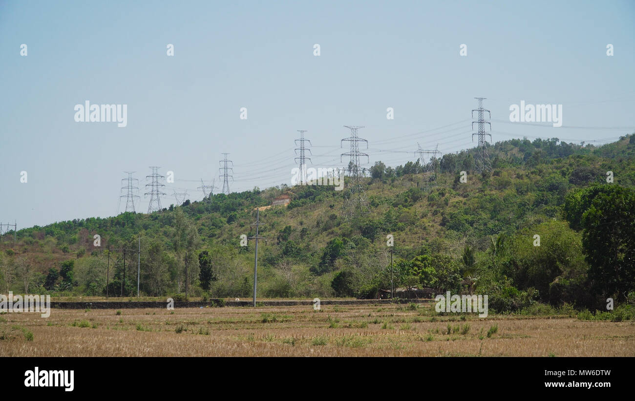 Power pylons and high voltage lines passing through mountain cordillera