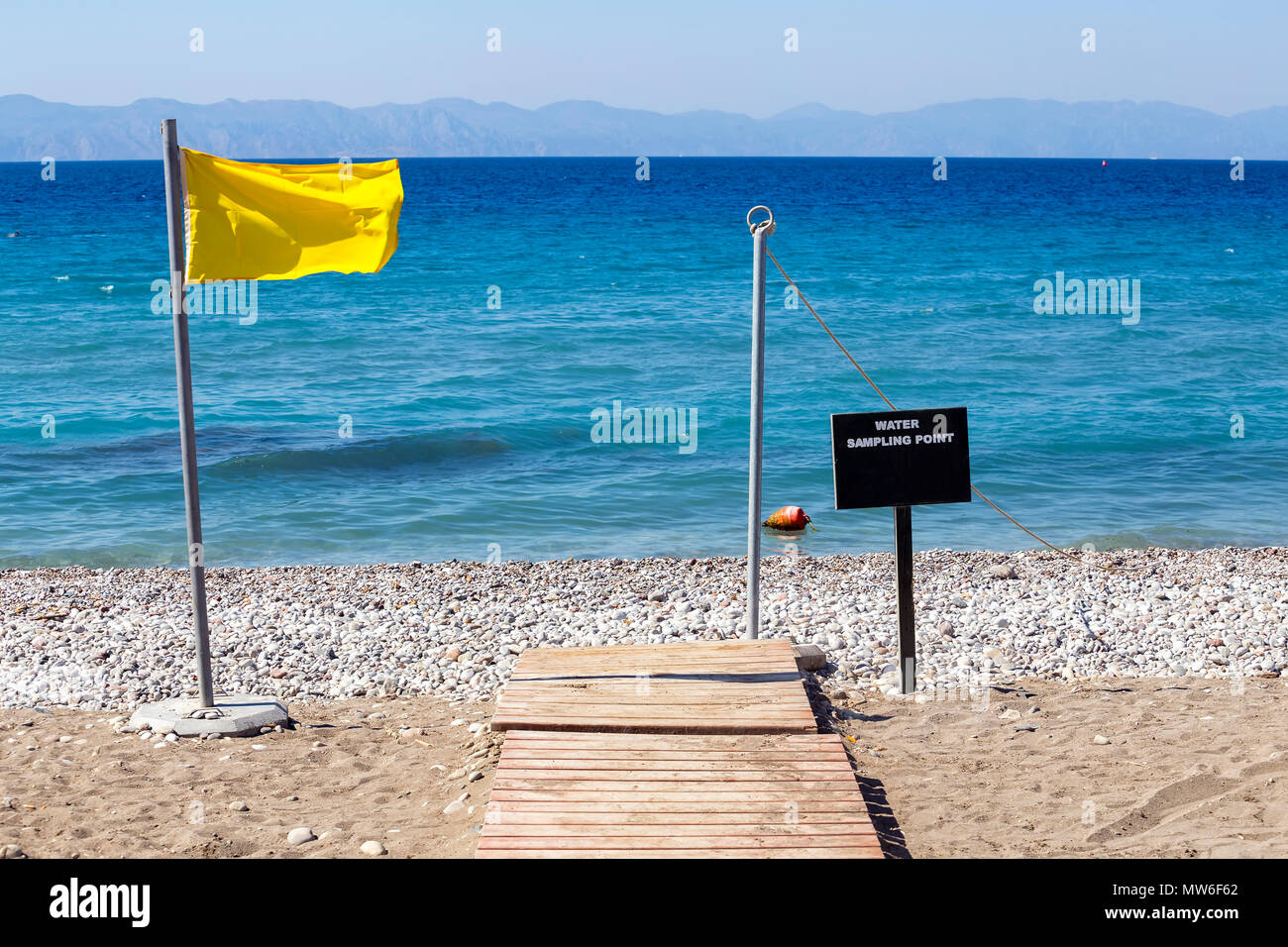 Water sampling point for blue flag beach, that a beach, marina or sustainable boating tourism operator meets its stringent standards. Stock Photo