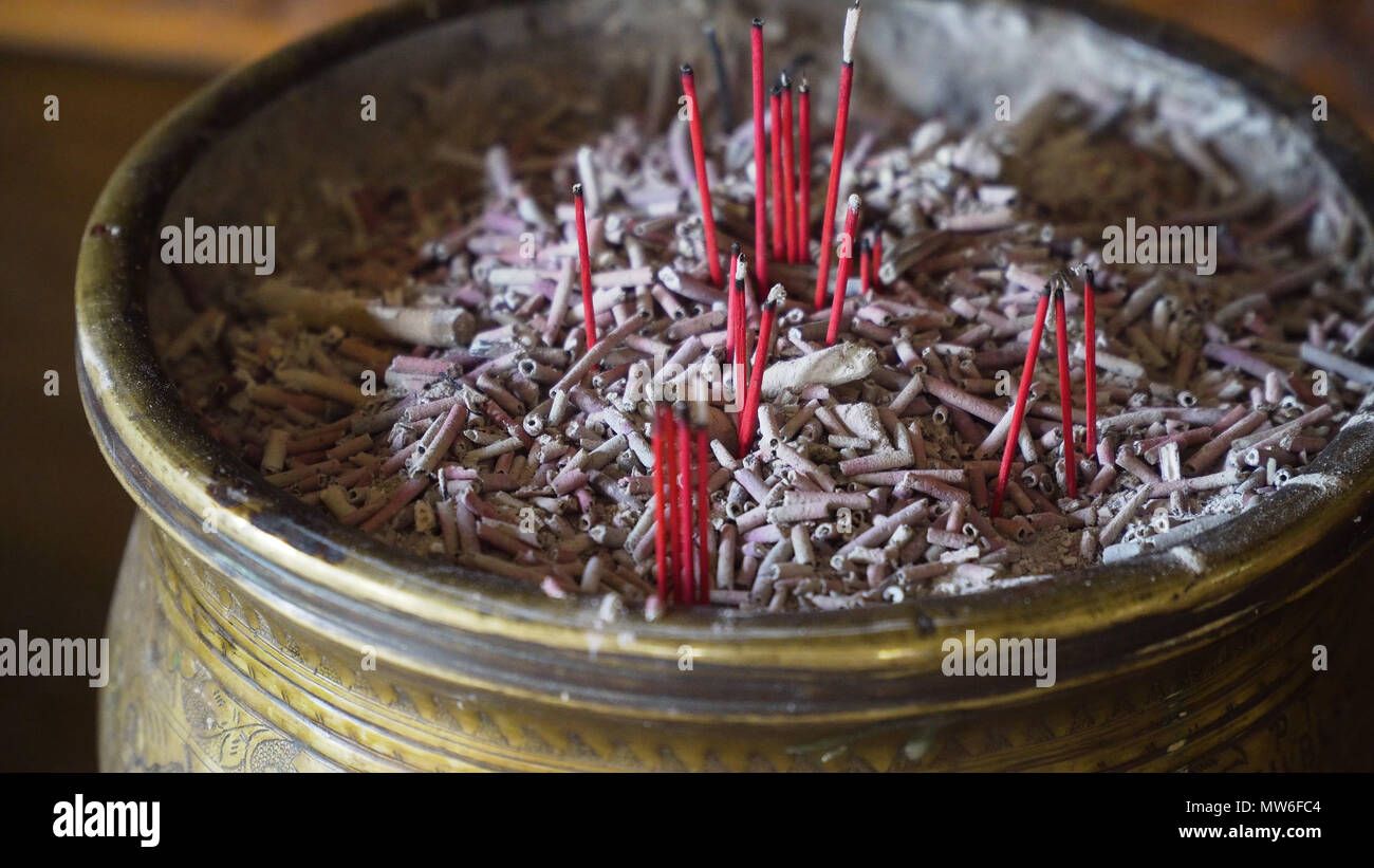Burning incense sticks in a Buddhist temple on the island of Bali