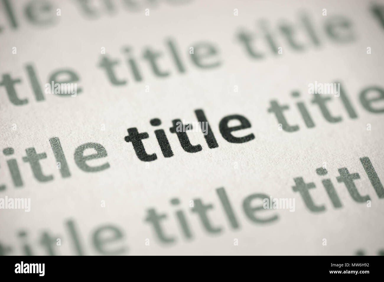 word title printed on white paper macro Stock Photo