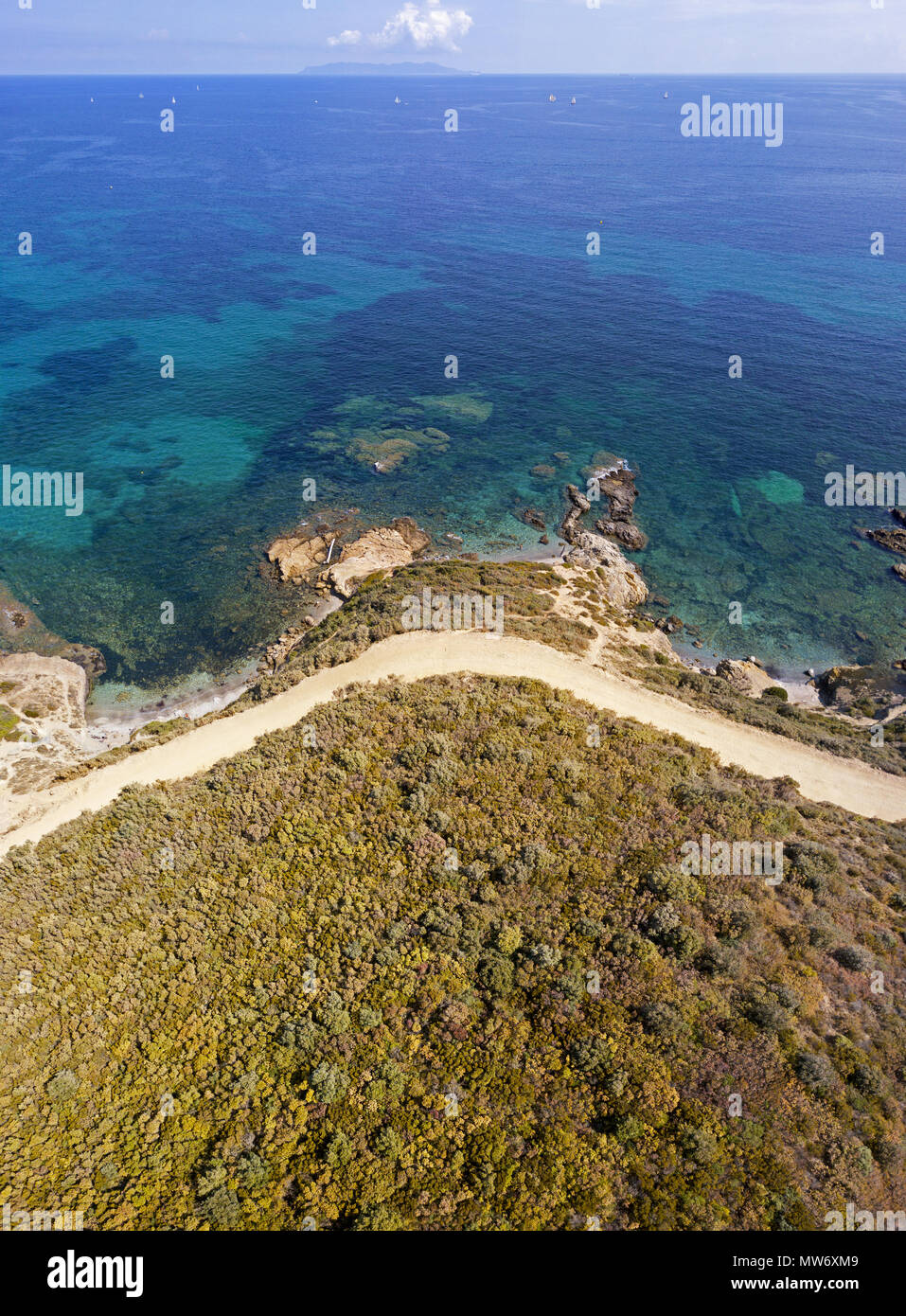 Aerial view of the path of customs officers, vegetation and Mediterranean bush, Corsica, France. Sea and vegetation seen from above, rocks Stock Photo