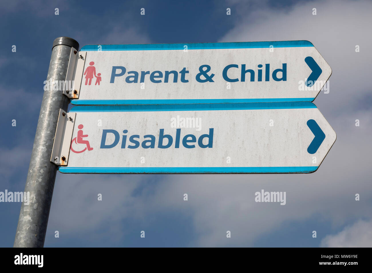 Signs for parent and child and disabled parking in a Tesco car park