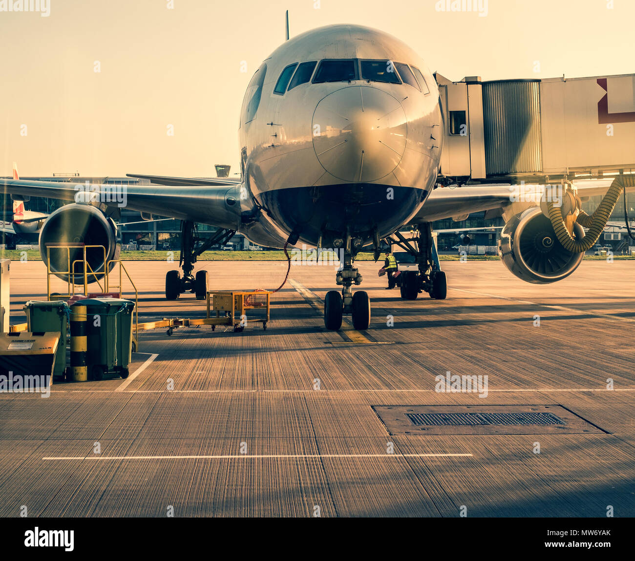 Front view of landed airplane in a terminal of Heathrow airport; London UK. Stock Photo