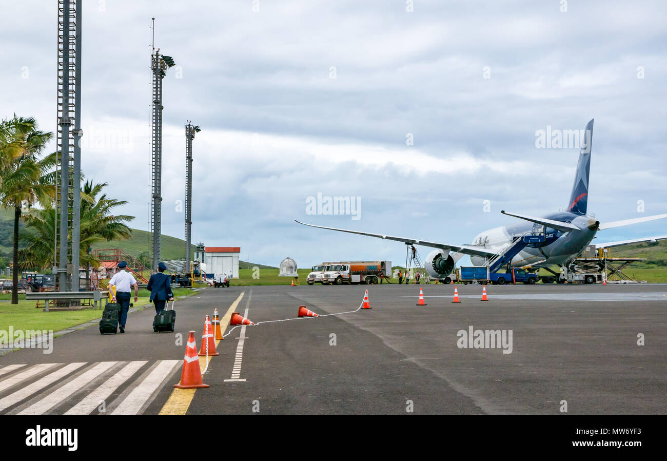Pilots boarding LATAM airline Dreamliner Boeing 787 on airport apron at Mataveri International Airport runway, Easter Island, Chile Stock Photo