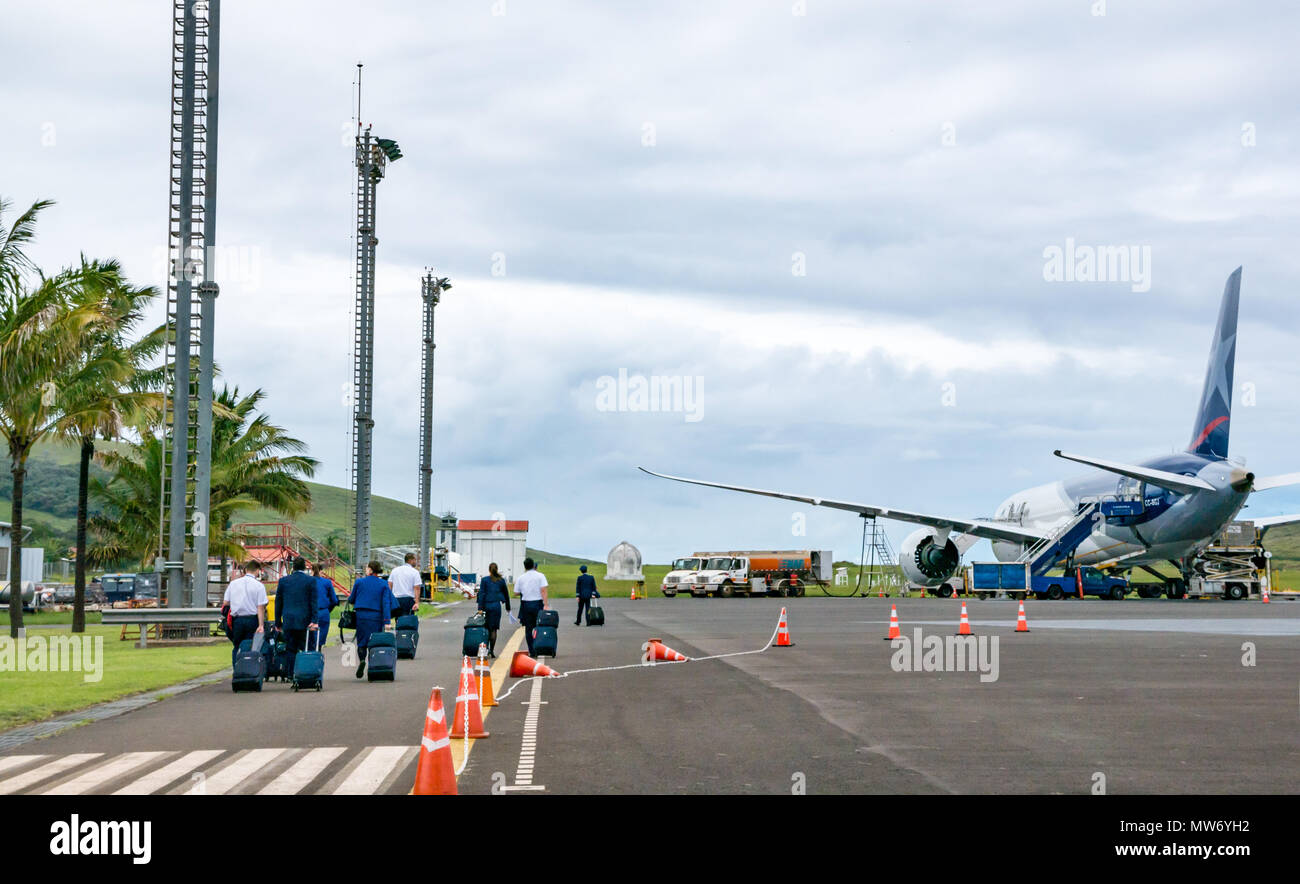 Crew boarding LATAM airline Dreamliner Boeing 787 on airport apron at Mataveri International Airport runway, Easter Island, Chile Stock Photo