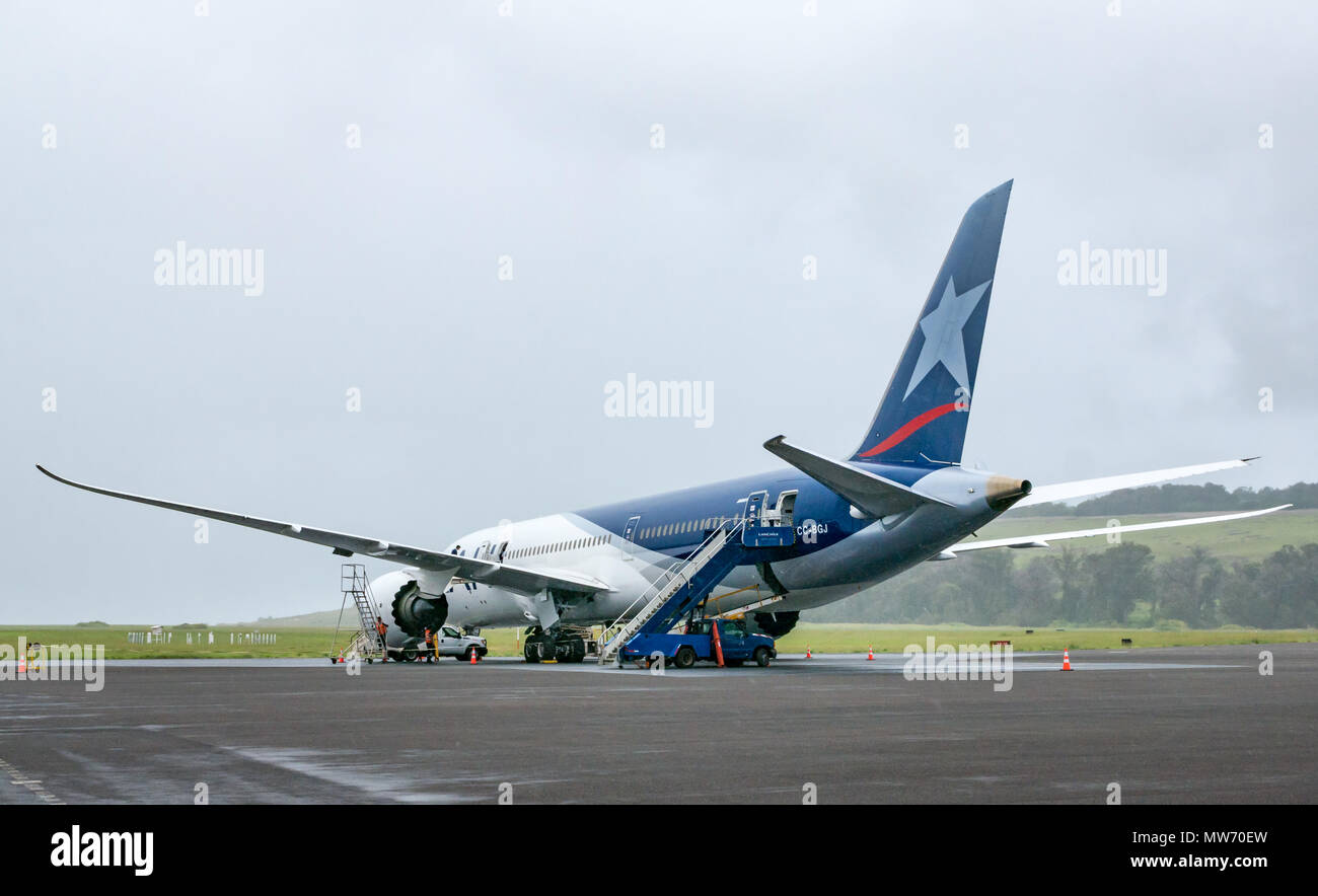 LATAM airline Dreamliner Boeing 787 on airport apron during rainy weather at Mataveri International Airport runway, Easter Island, Chile Stock Photo