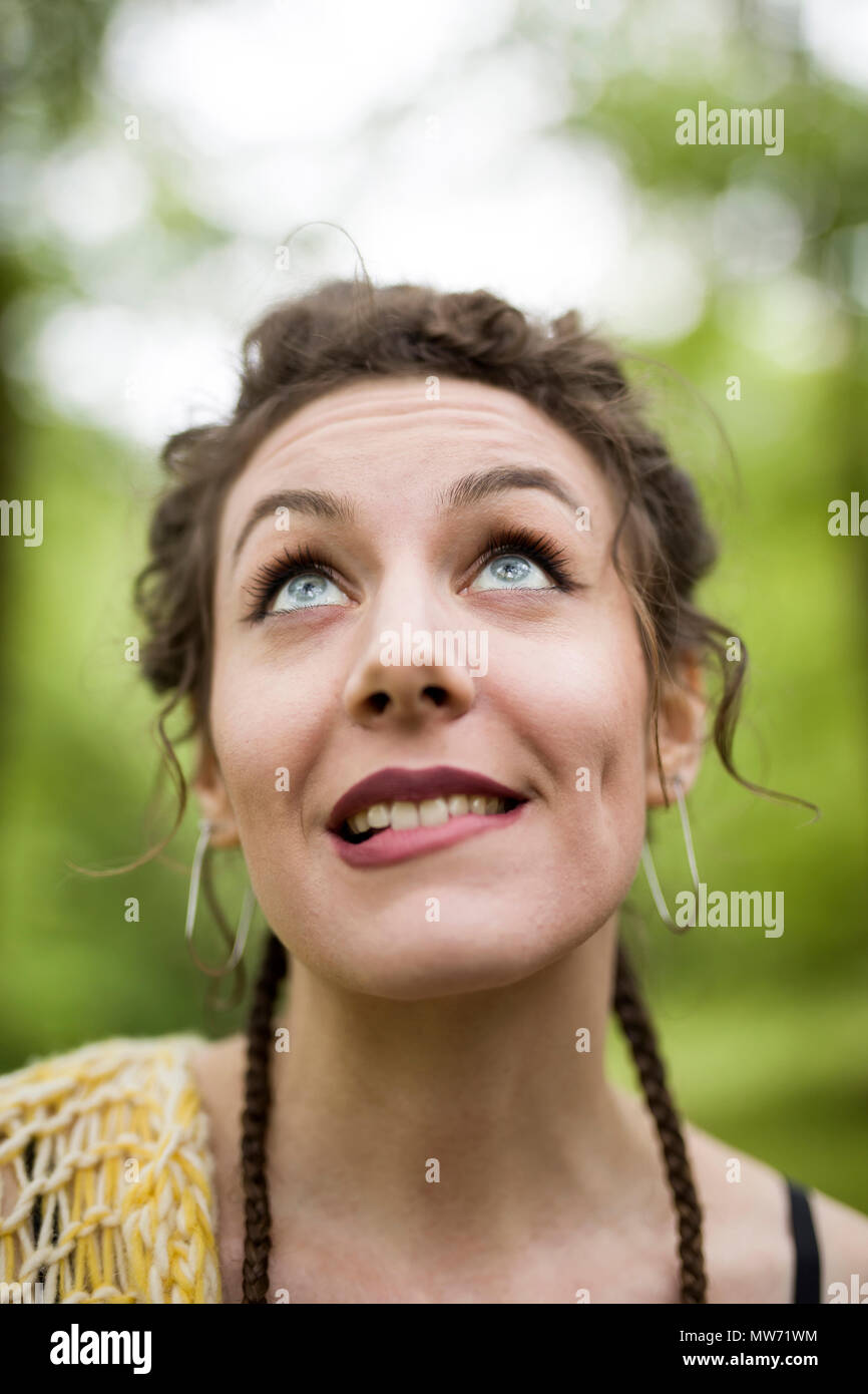 Portrait of young woman makes facial gesture Stock Photo