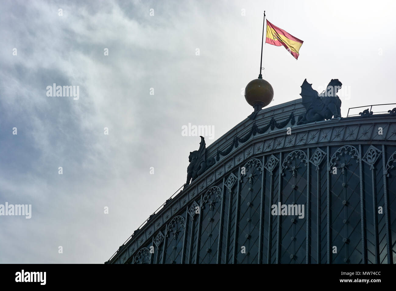 MADRID, SPAIN - APRIL 23, 2018: Details and sculptures of the top of the facade of the Puerta de Atocha railway station in Madrid, Spain. Stock Photo