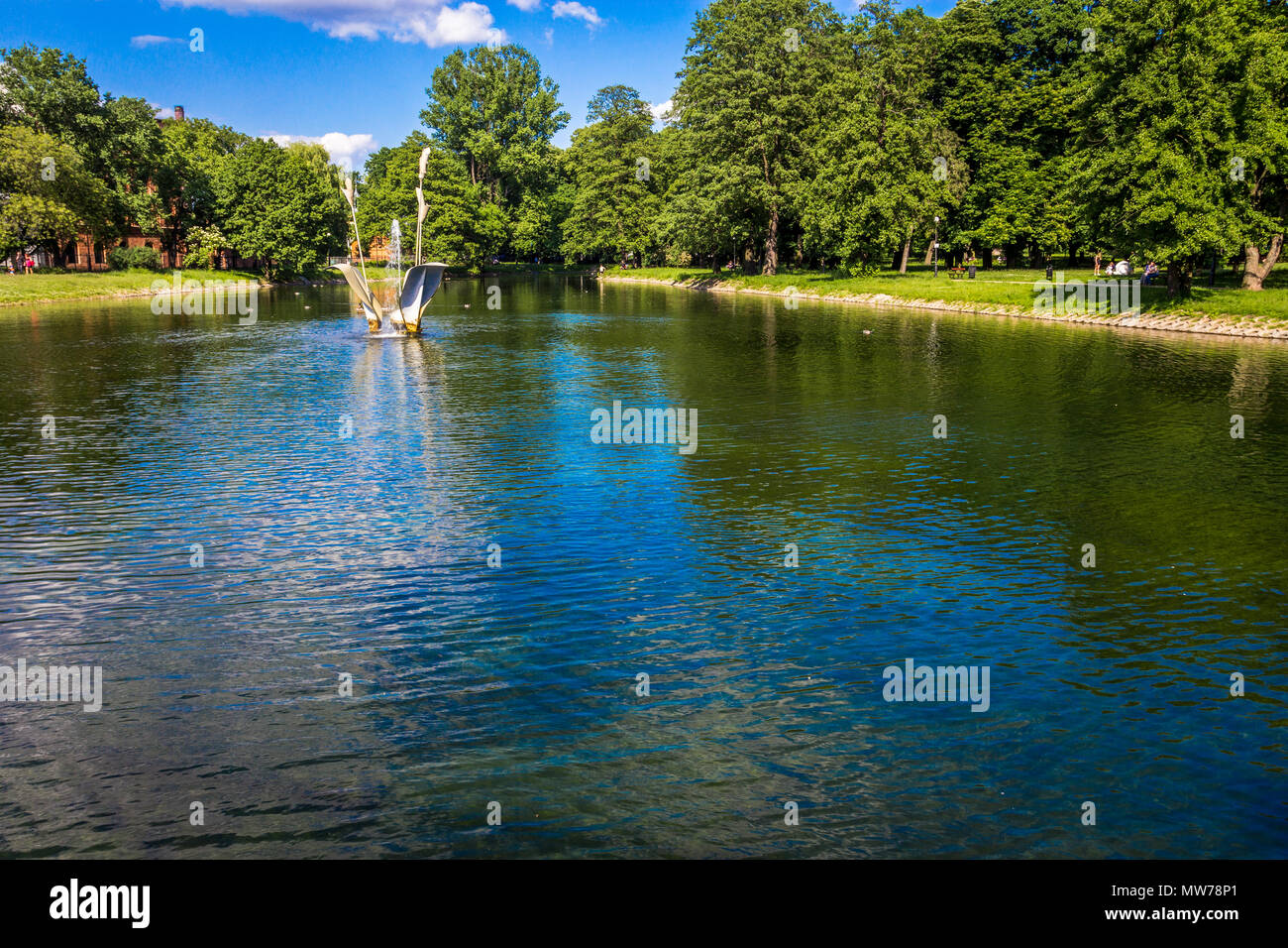 Lake at Park Reymonta, Lodz, Poland, showing a fountain , the first of the program 'Fountains for Łódź,' Stock Photo