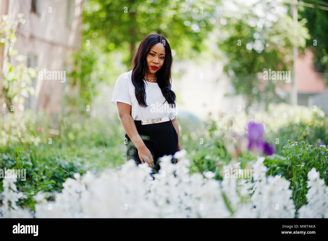 Stylish african american business woman on streets of city Stock Photo ...