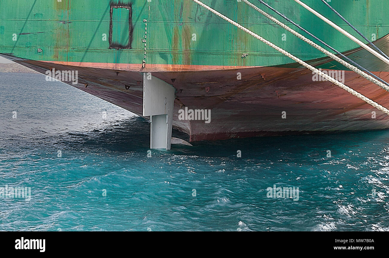 Stern Of Cargo Ship . Close-up.Ship laid up alongside in shipyard for