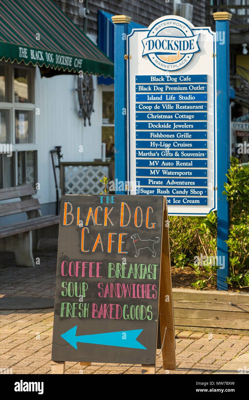 A sign points customers to the Black Dog Cafe in the Dockside Waterfront Marketplace on Oak Bluffs marina on Martha's Vineyard. Stock Photo