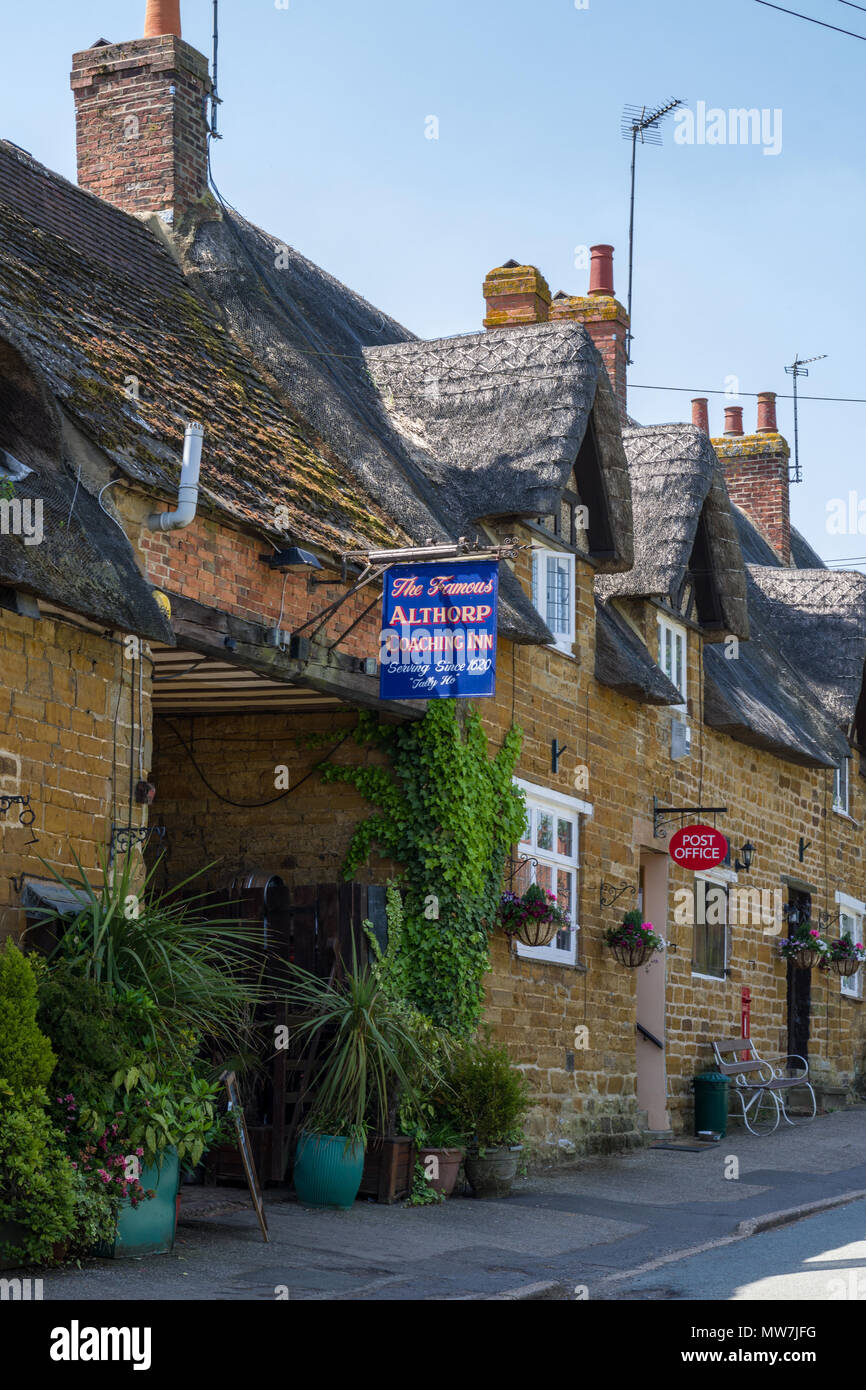The Althorp Coaching Inn (or Fox and Hounds as it was previously known), a 16th century thatched and stone-built inn Great Brington, UK Stock Photo