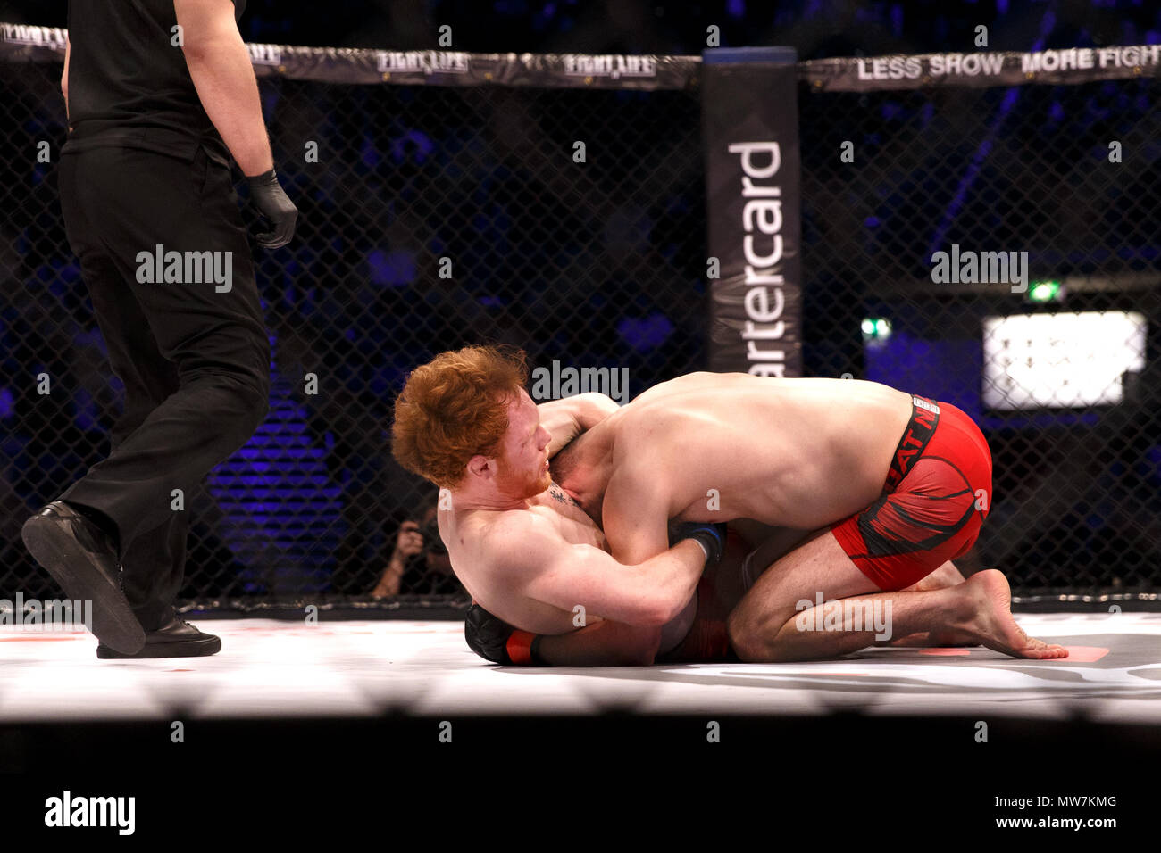 Mixed Martial Artist Connor Hignett (left) holds Aaron Aby in a headlock manouver during a catchweight contest at ACB 54 in Manchester, UK. Aby won after three rounds by split decision. Absolute Championship Berkut, Mixed Martial Arts, MMA. Stock Photo