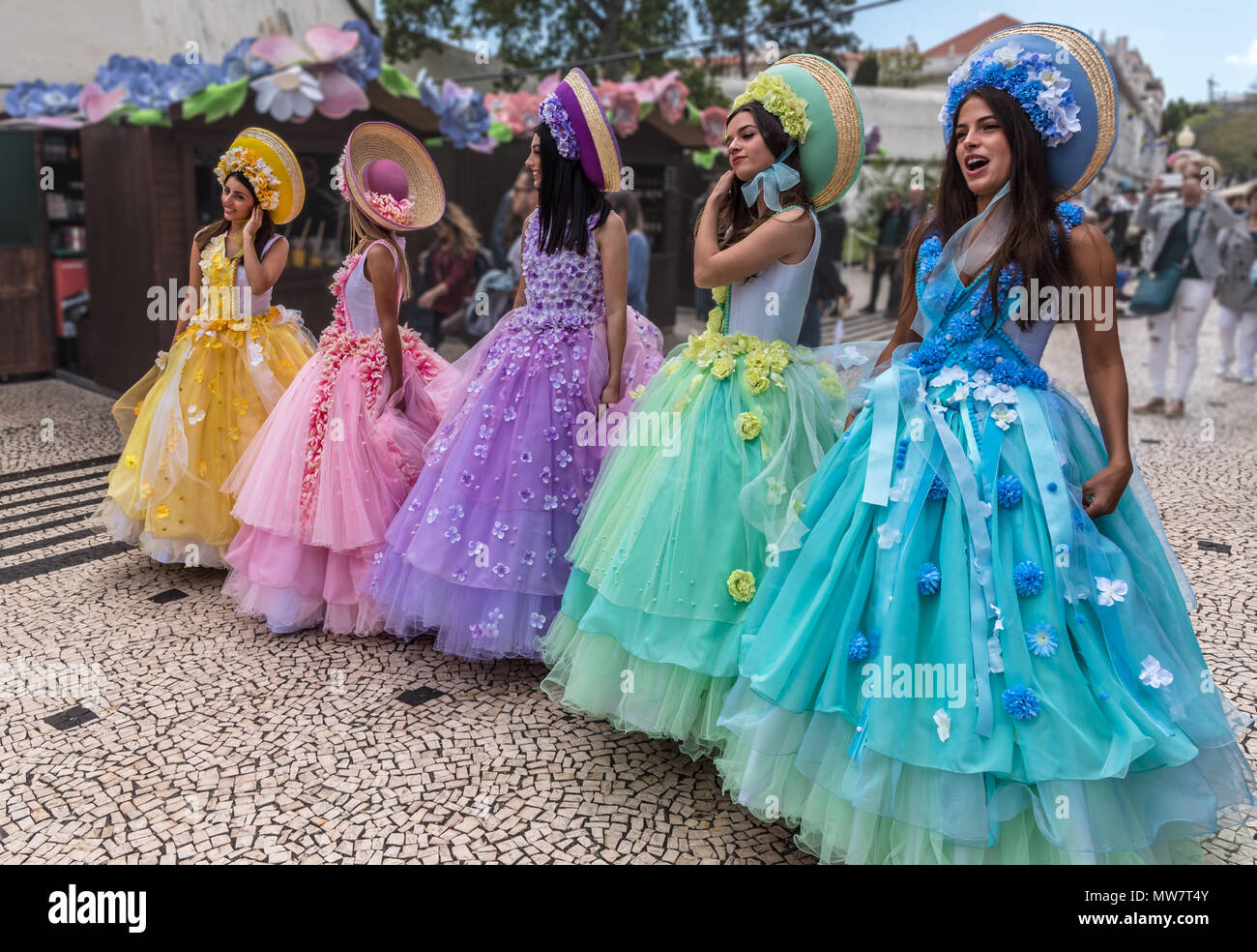 Girls advertising Madeira Rum exhibition during Madeira Flower Festival Stock Photo