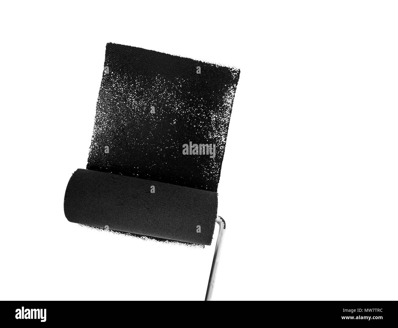 Painting wall in black with a paint roller Stock Photo