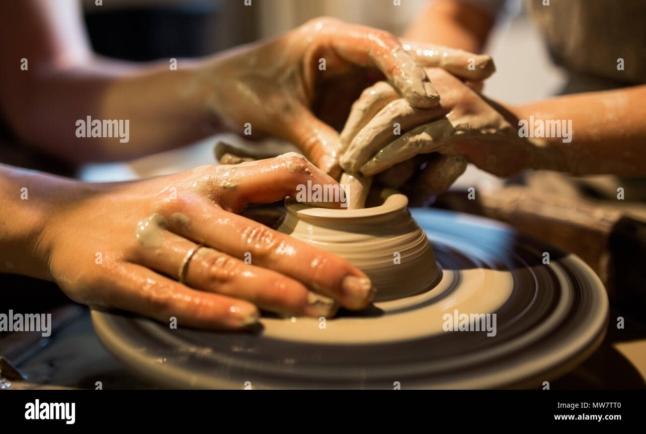 Man making pottery art, clay work close up hands shot shot Stock