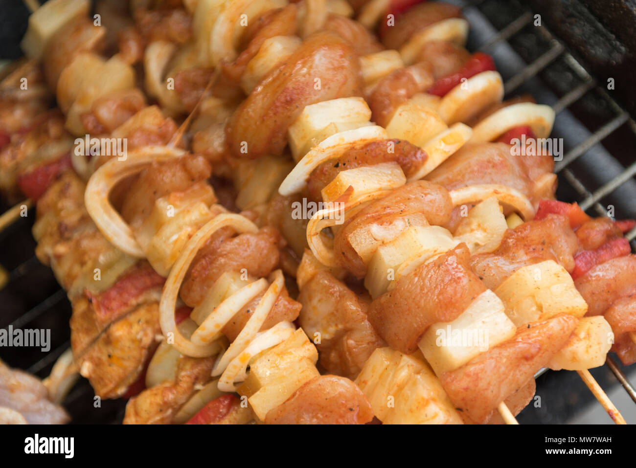 skewers on the grill with meat, peppers and onions Stock Photo Alamy