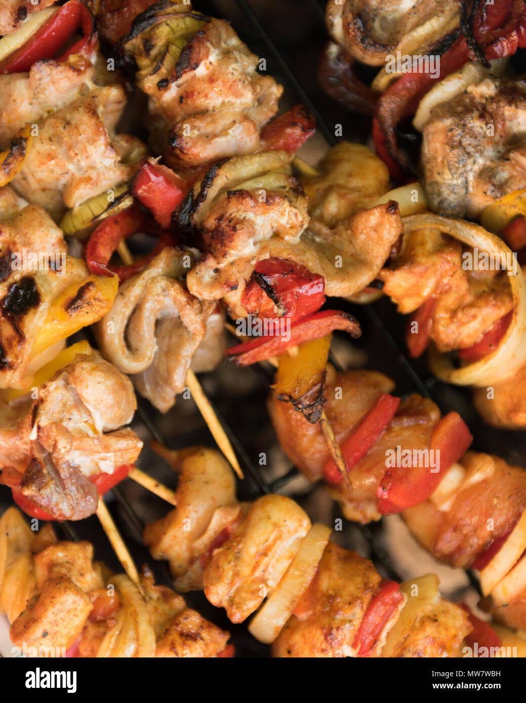 skewers on the grill with meat, peppers and onions Stock Photo Alamy