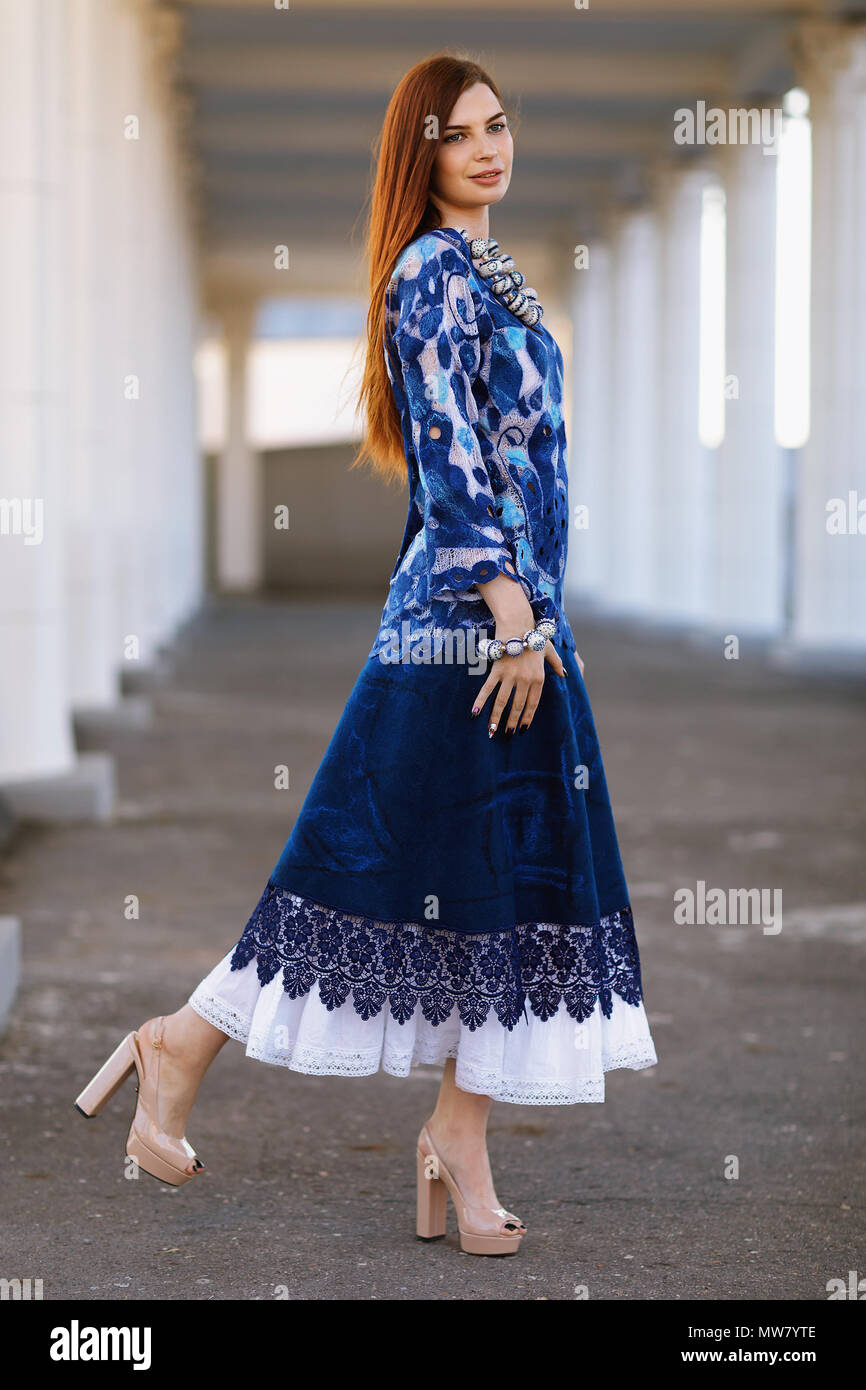 https://c8.alamy.com/comp/MW7YTE/stylish-beautiful-girl-in-designer-clothes-she-wore-a-tunic-blue-lace-it-is-made-in-the-technology-of-nunovolok-on-white-rarefied-silk-of-merino-wo-MW7YTE.jpg