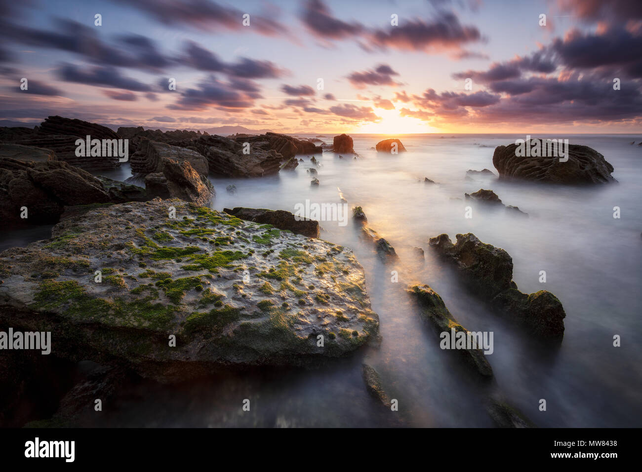 Long exposure photo at sunset at Barrika beach in Bizkaia Stock Photo