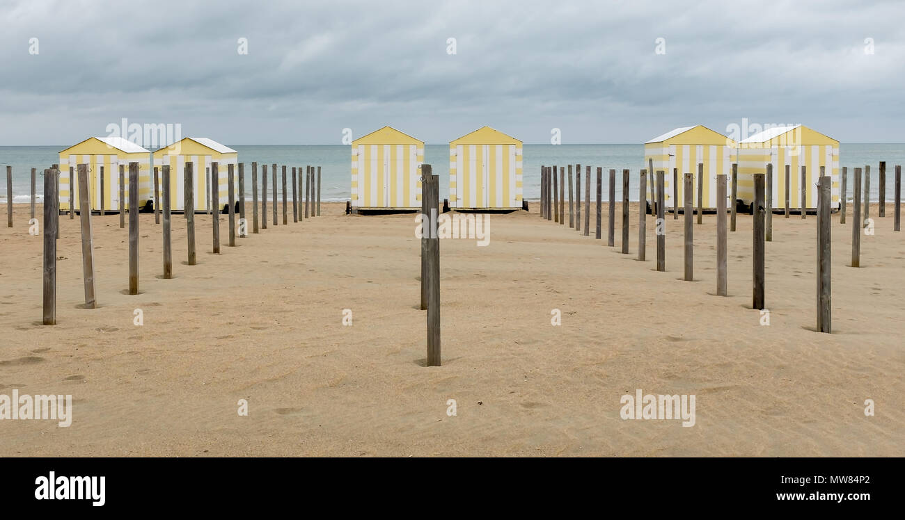 Image of a row of colourful beach houses in De Panne, Belgium. De Panne