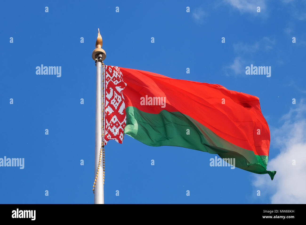 National flag of Belarus (Republic of Belarus) on the State Flag Square in Minsk. A giant flag is flying in the wind. Stock Photo